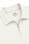 Close-up of Airloop White Zipper Polo collar and quarter-zip detail