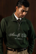 Close-up of Deep Forest Amalfi Quarter Zipper with Amalfi Club lettering, worn by a man