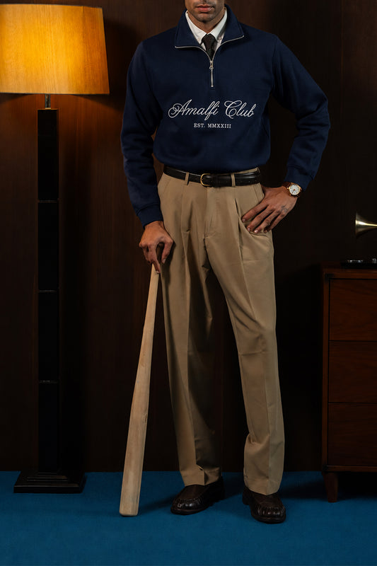 Man wearing the Navy Amalfi Quarter Zipper with khaki trousers, front view