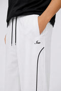 IVAR White Arc Track Pants - Close-Up Piping Detail - IVAR Clothing