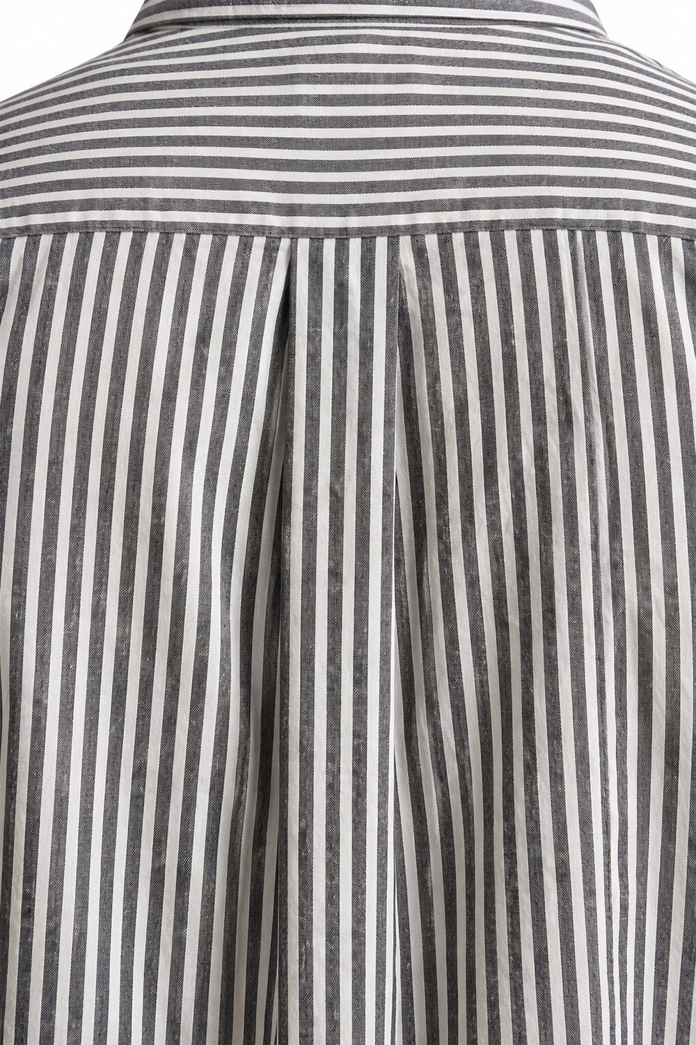 Close-up shot of the back yoke and box pleat design on the grey and white Striped Shirt.