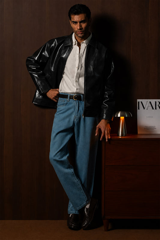 Man wearing the Black Braided Maverick Leather Jacket with blue trousers, front view