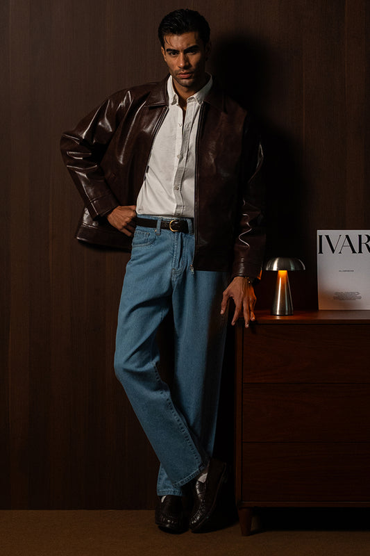 Man wearing the Brown Braided Maverick Leather Jacket with blue trousers, front view