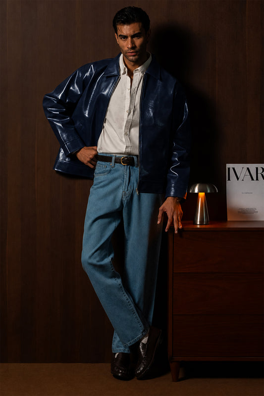 Man wearing the Navy Braided Maverick Leather Jacket with light blue trousers, front view
