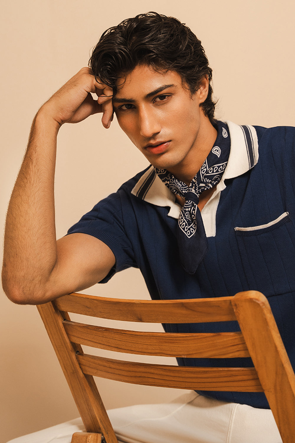 IVAR Navy Cambridge Flat Knit Polo - Model Wearing, Seated - IVAR Clothing