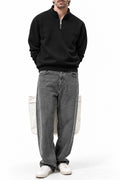 Man wearing the Black Classic Fleece Quarter Zipper with grey joggers