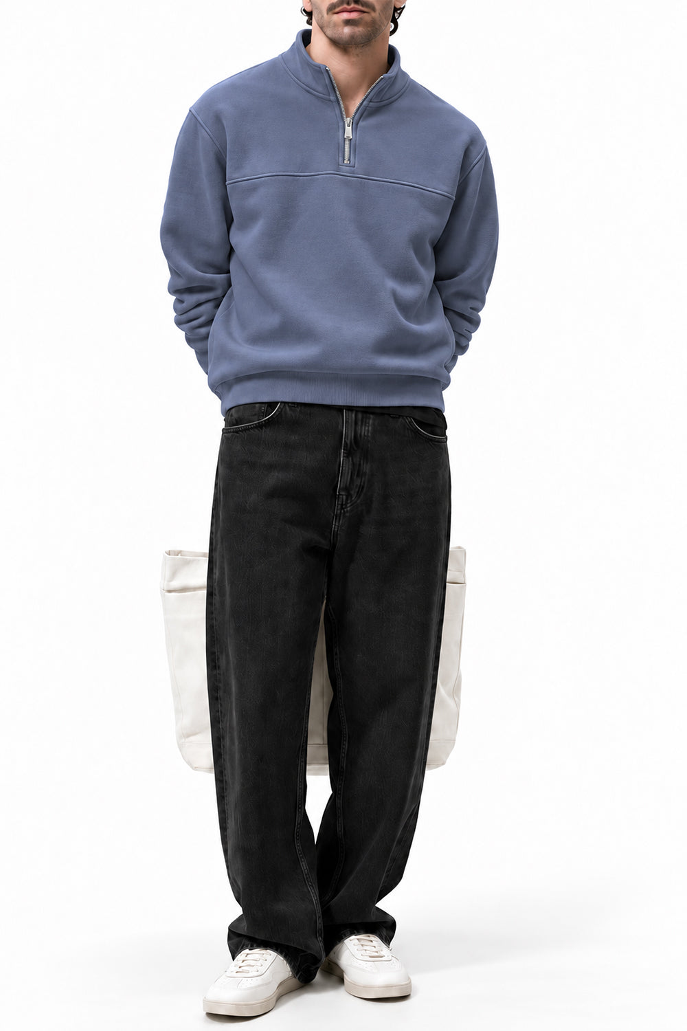 Man wearing the Grey Classic Fleece Quarter Zipper with black trousers