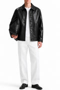 Man wearing the Black Coat Leather Jacket with white trousers, front view