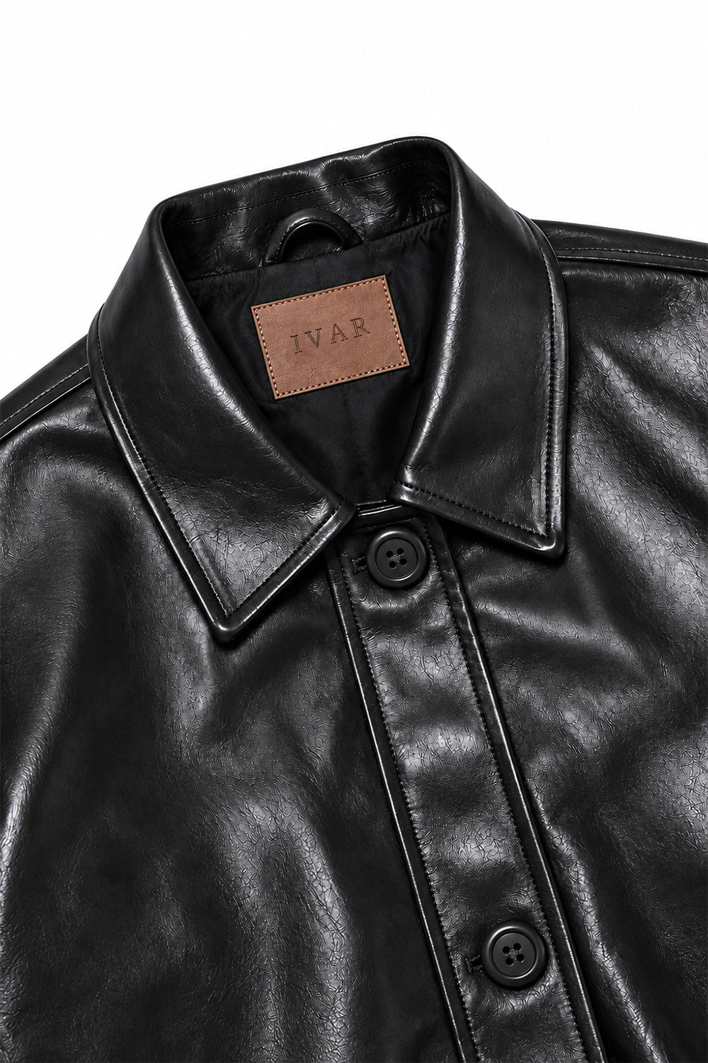 Close-up of Black Coat Leather Jacket collar and button closure