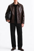 Man wearing the Brown Coat Leather Jacket with black trousers, front view