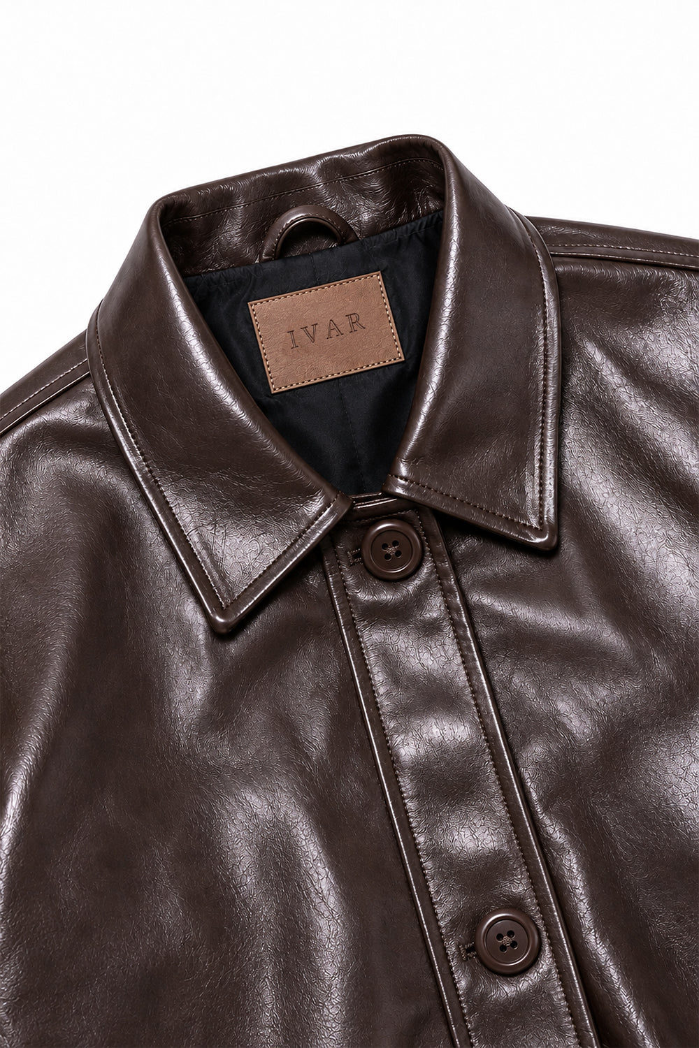 Close-up of Brown Coat Leather Jacket collar and button closure