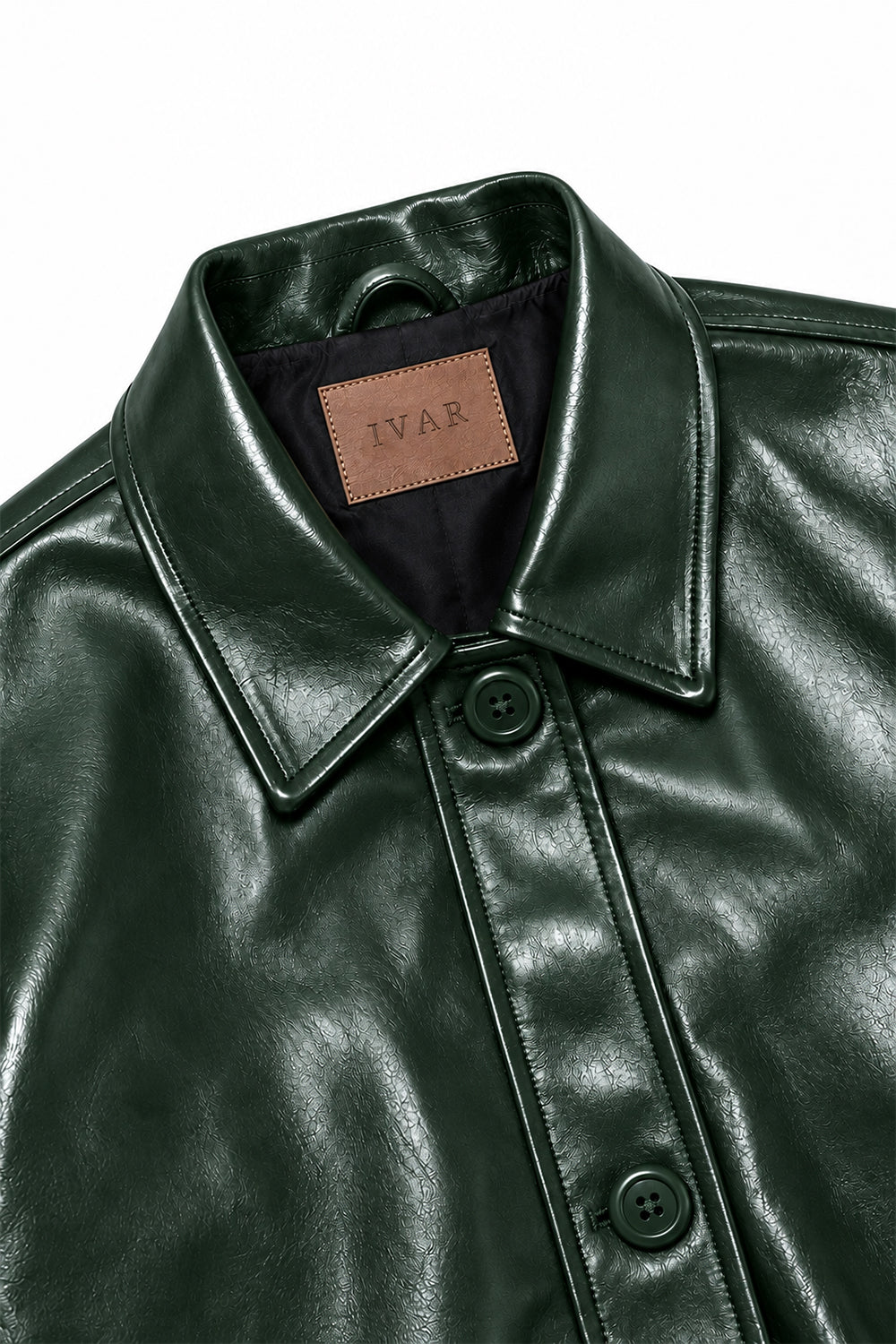 Close-up of Deep Forest Coat Leather Jacket collar and button closure