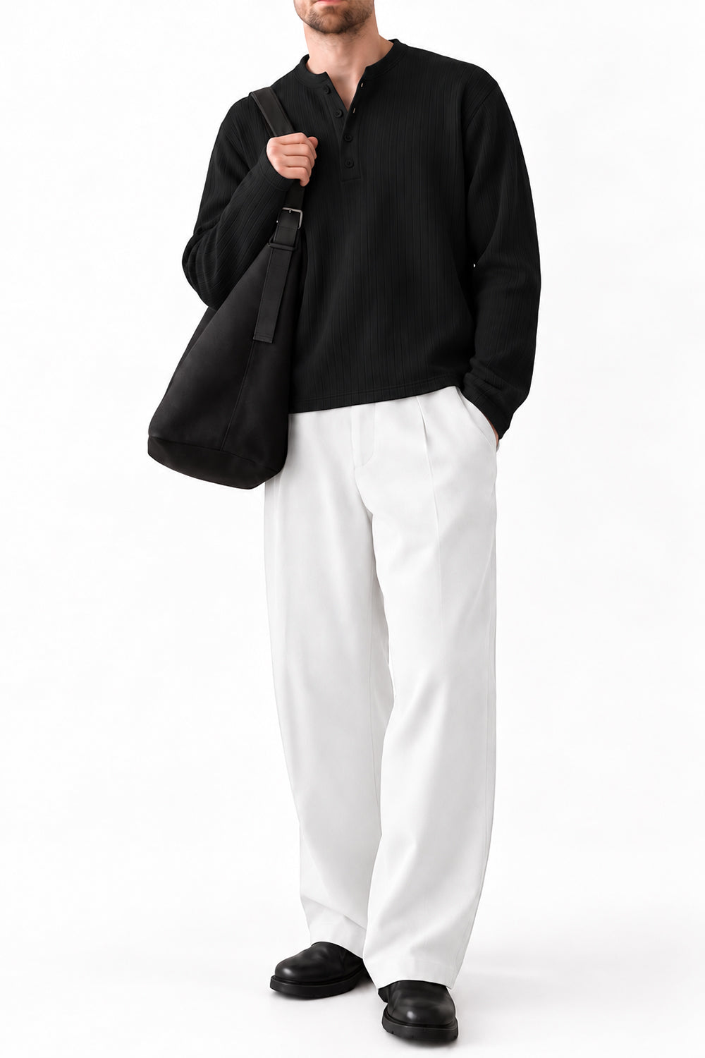 Man wearing IVAR black dropneedle full sleeve henley with white trousers