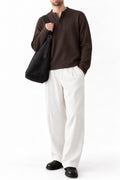 Man wearing IVAR brown dropneedle full sleeve henley with white trousers