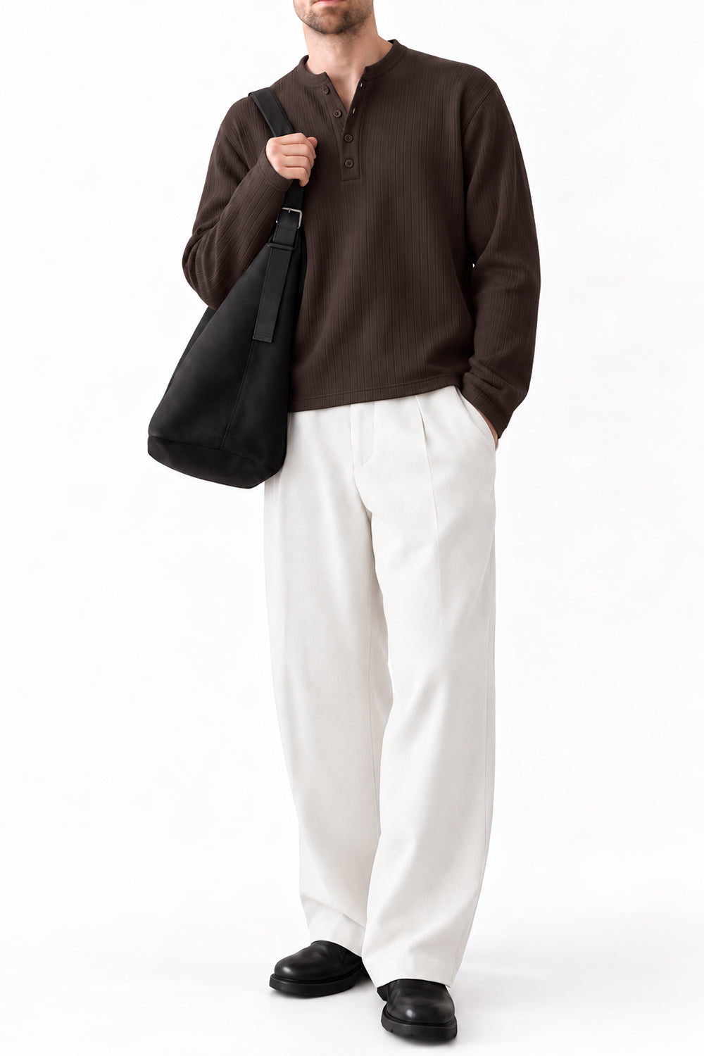 Man wearing IVAR brown dropneedle full sleeve henley with white trousers