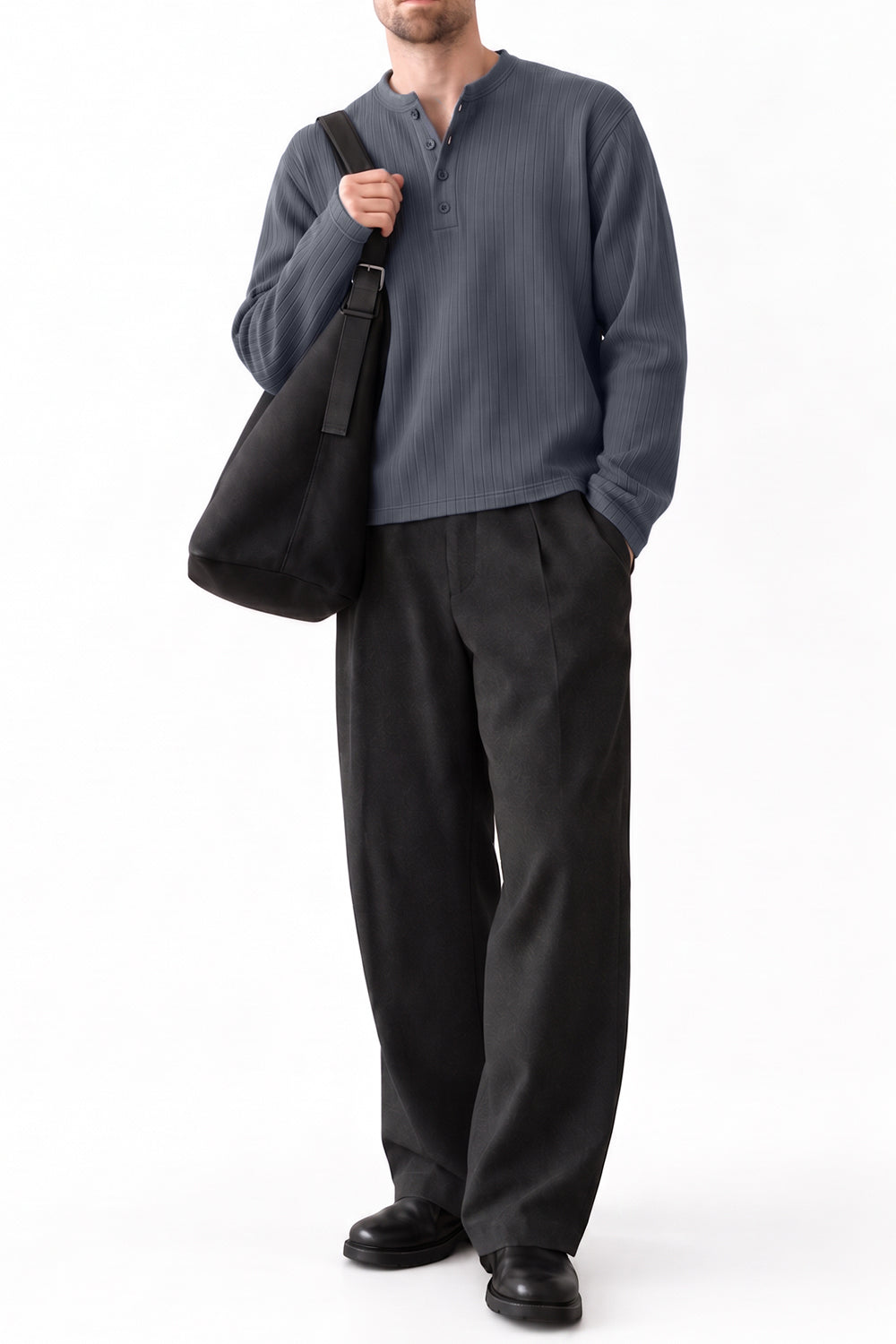 Man wearing grey dropneedle full sleeve henley with black trousers