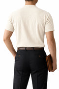  Man wearing oatmeal short-sleeve Henley shirt with ribbed hem, back view