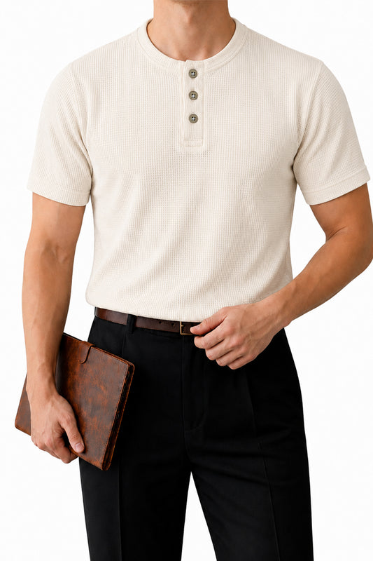  Man wearing oatmeal short-sleeve Henley shirt with black pants