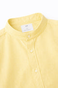 Close-up of yellow Collar Linen Shirt showing band collar and button placket detail