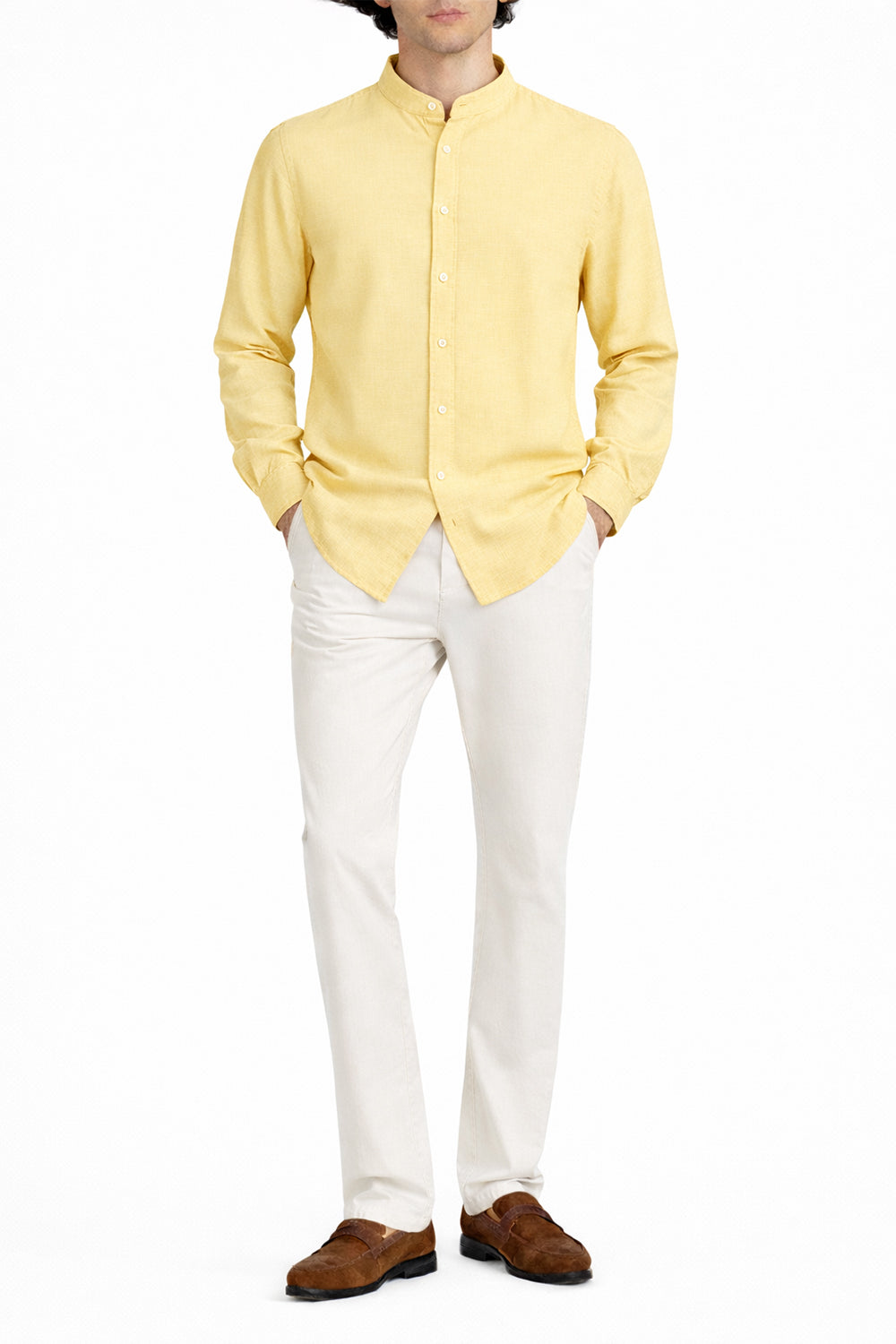 Man wearing yellow Collar Linen Shirt paired with white trousers and brown shoes
