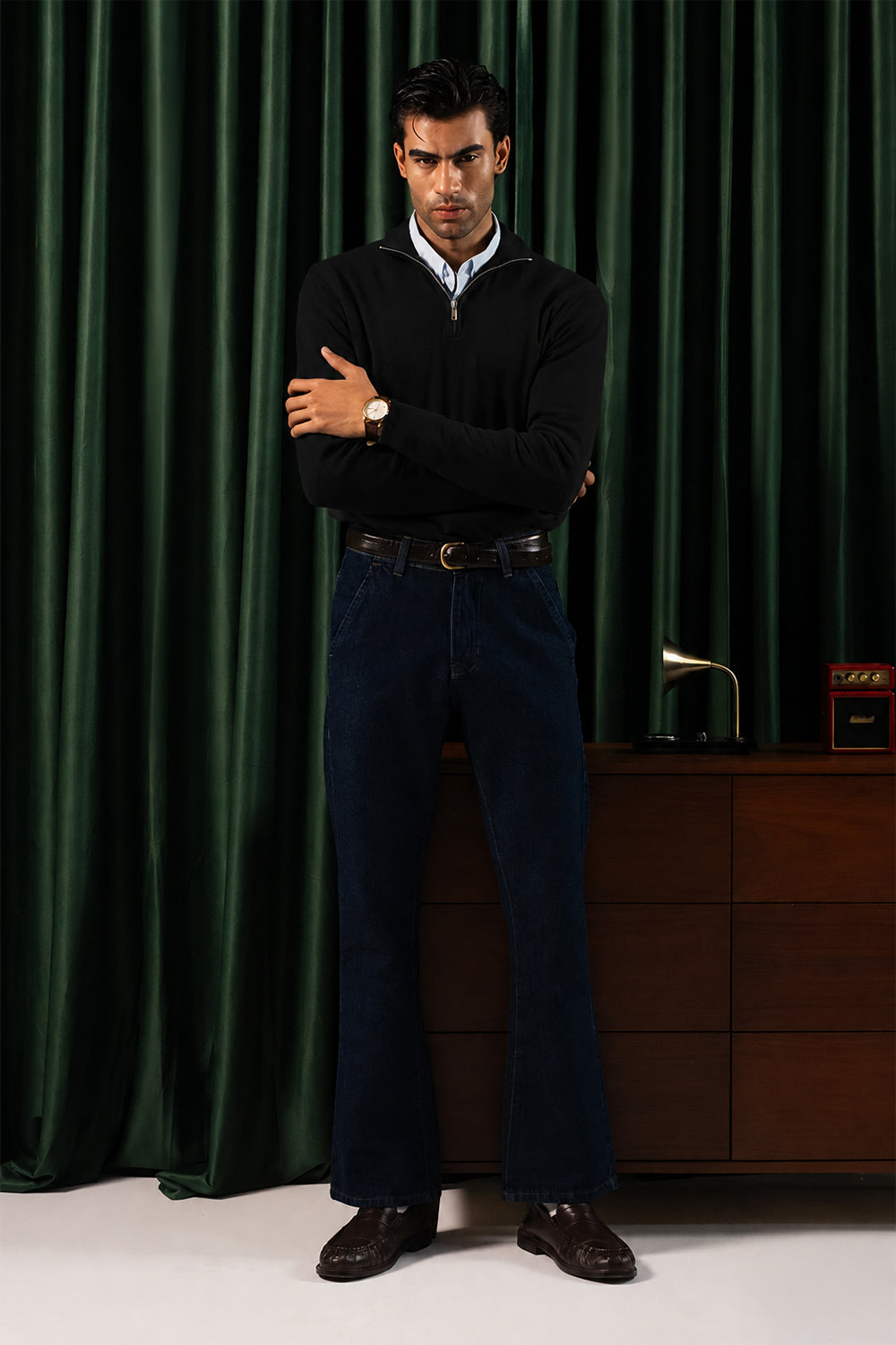 Man wearing the Black Merino Style Flat Knit Quarter Zipper with dark trousers, front view