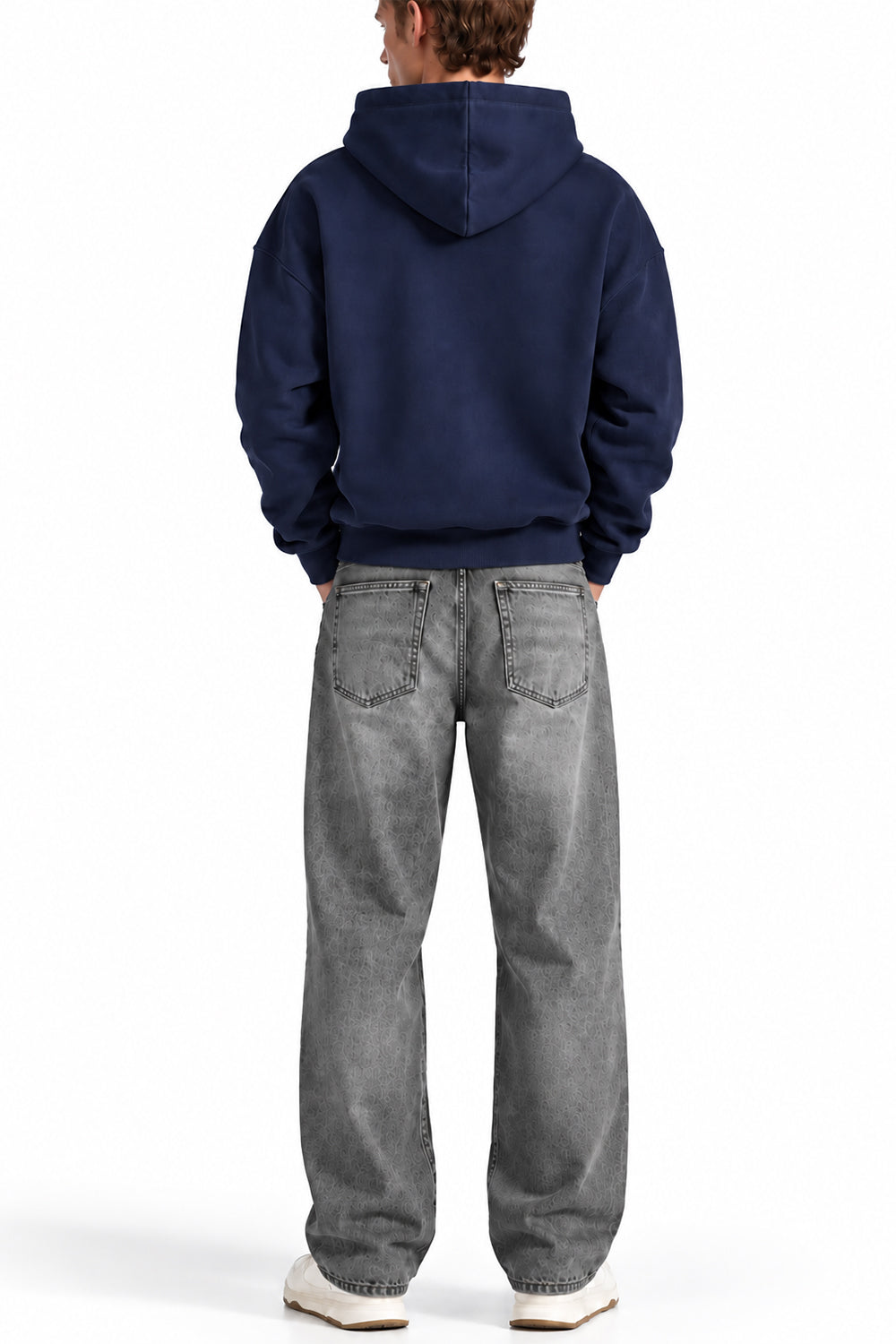 Man wearing the Navy NYC Hoodie with grey jeans, back view