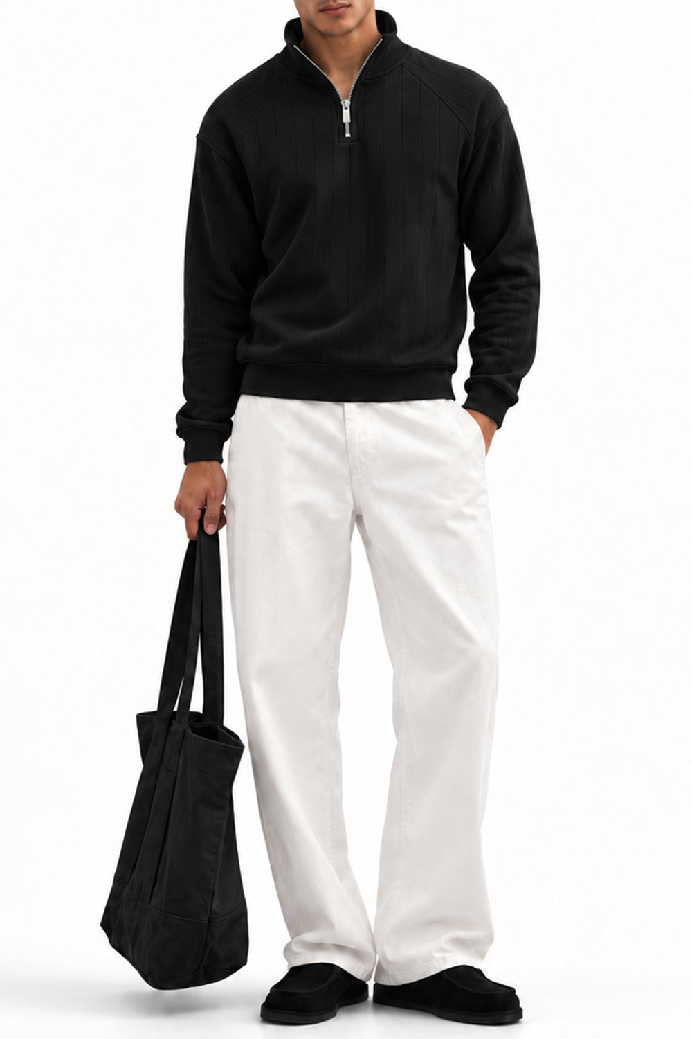 Man wearing the Black Raglan Drop Needle Quarter Zipper with white trousers, front view
