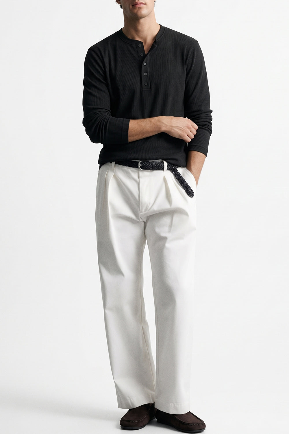Man wearing the Black Ribbed 5 Button Henley with white trousers, front view