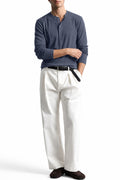 Man wearing the Grey Ribbed 5 Button Henley with white trousers, front view