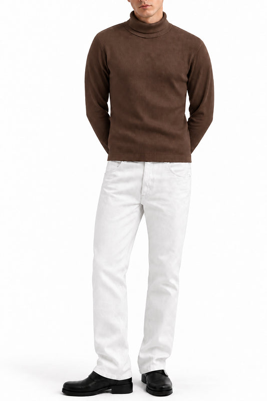 Man wearing the Brown Ribbed Highneck with white trousers