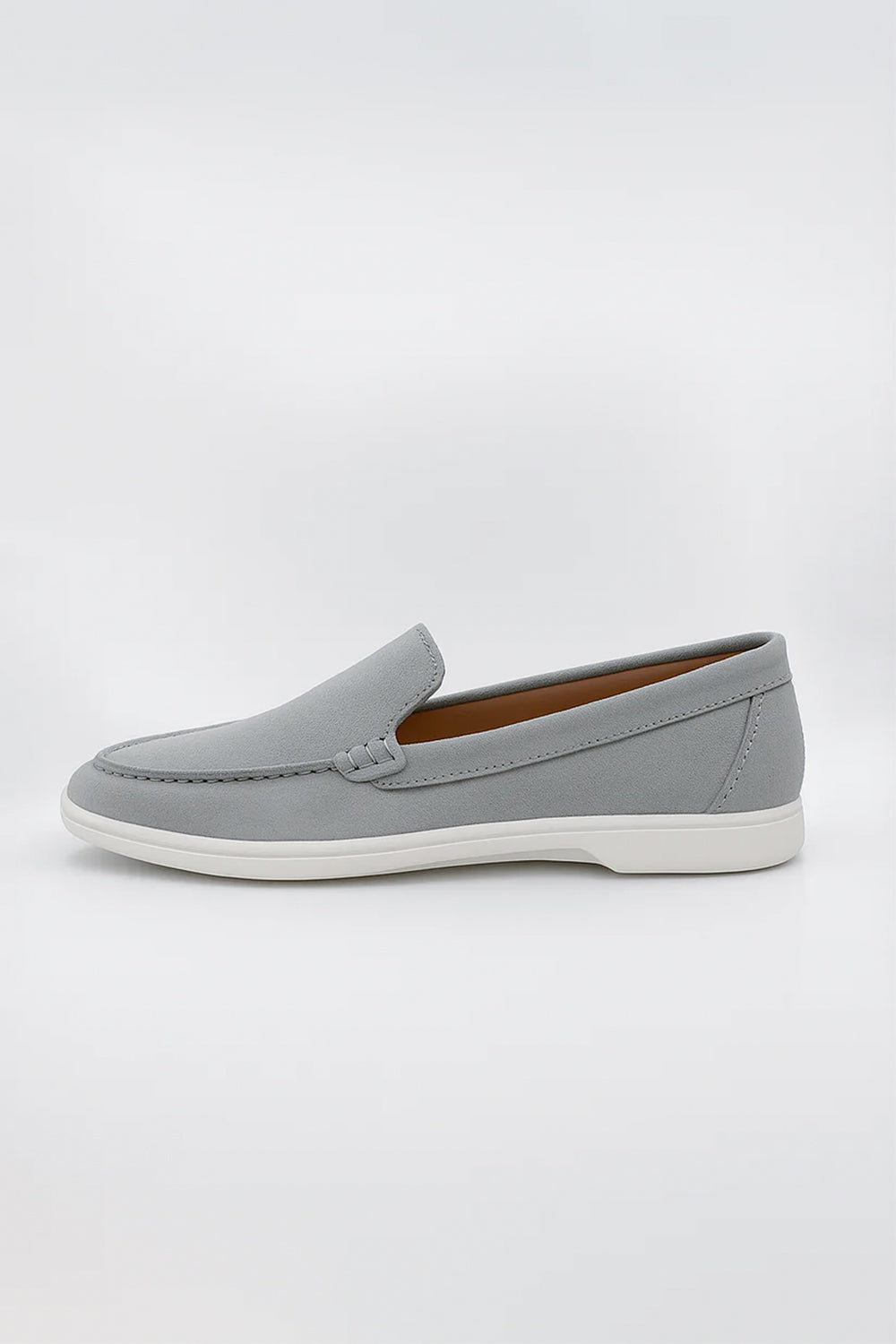 Suede Loafers shoe featuring detailed moc-toe stitching and a contrasting white rubber sole