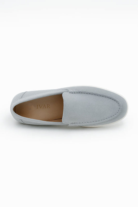 a single grey Suede Loafers shoe showcasing the smooth inner lining, branded insole, and classic slip-on shape.