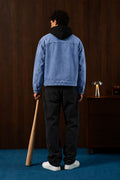 Man wearing the Washed Blue Timeless Denim Jacket, back view