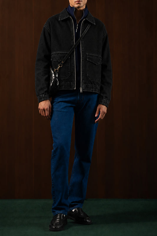 Man wearing the Charcoal Workshop Denim Jacket with blue jeans, front view