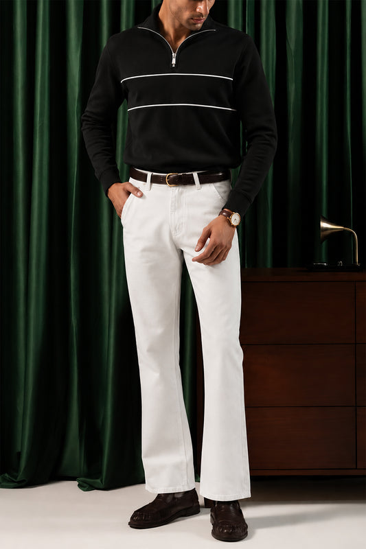 Man wearing the Black Yacht Fleece Quarter Zipper with white trousers, front view